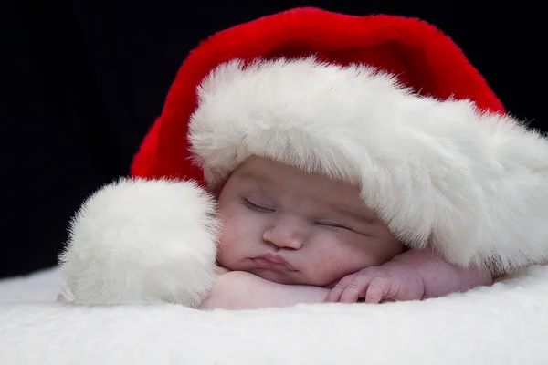 Großaufnahme Baby mit Weihnachtsmütze — Stockfoto