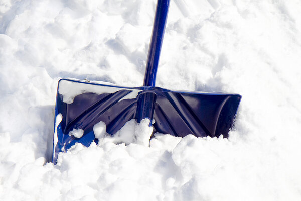 Blue Snow Shovel in Snow