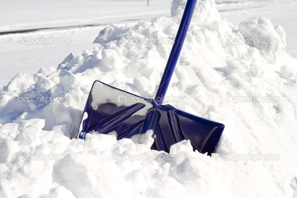 Blue Snow Shovel in Snow — Stock Photo © TrudyWilkerson #39410609