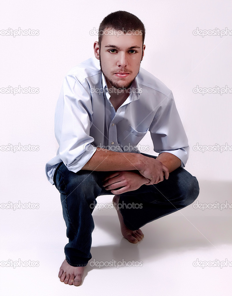 Young Man Posing Isolated in White