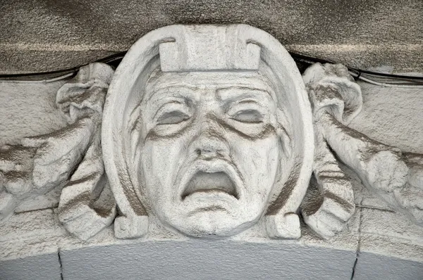 Decorative of the balcony with sculpture of a woman's head — Stock Photo, Image