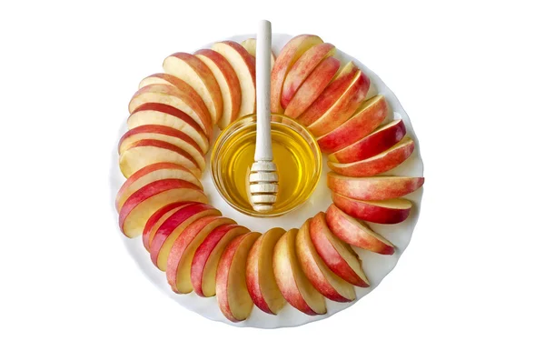 Skär i skivor av äpplen med en skål med honung — Stockfoto
