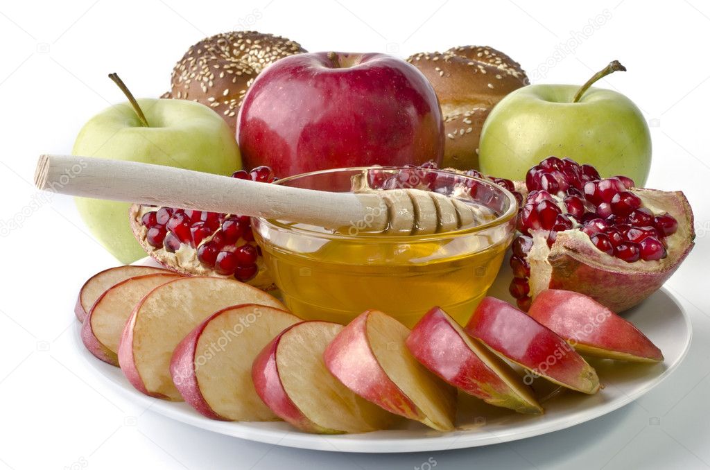 Still life - challah, apples, pomegranate and bowl of honey