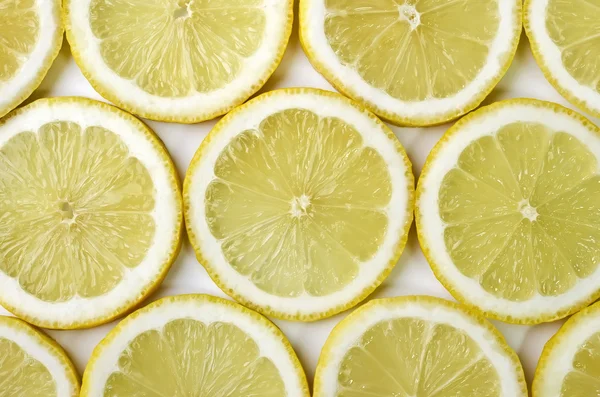 Fondo alimenticio - Tazas de limón en rodajas — Foto de Stock