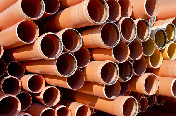 Plastic orange pipes — Stock Photo, Image