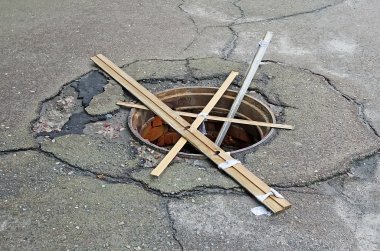 Manhole without a cover clipart
