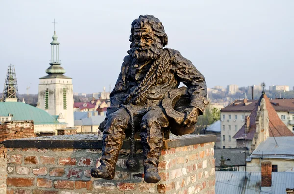 Sculpture of the chimney sweep on the roof — Stock Photo, Image