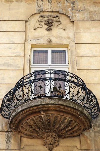 Forged old balcony and window