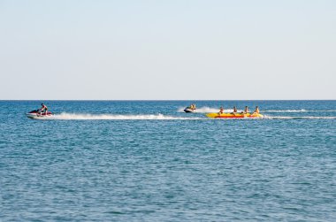 Attraction on the beach in the Crimea - jet ski carries tourists