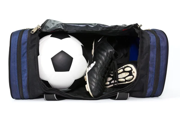 Football and soccer boots in sport bag — Stock Photo, Image