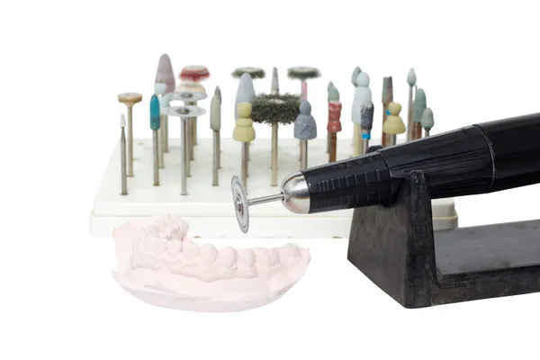 Antigo laboratório odontológico micromotor grunge e molde de dentes — Fotografia de Stock