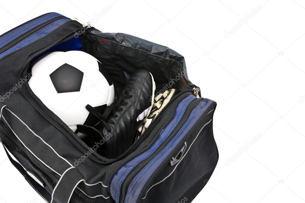football and soccer boots in sport bag