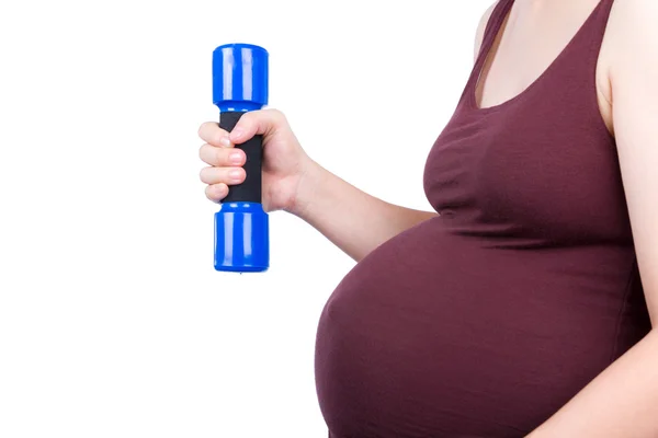 Pregnant woman exercising with dumbbell — Stock Photo, Image