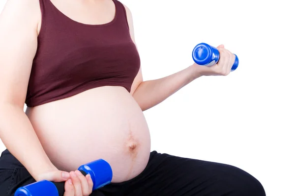 Pregnant woman exercising with dumbbell — Stock Photo, Image