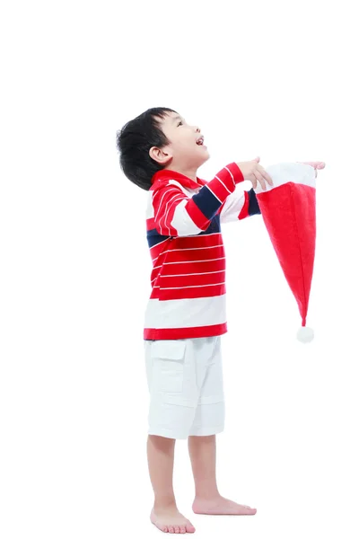 Menino feliz segurar chapéu de santa no fundo branco — Fotografia de Stock