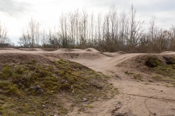 Skate park and mountain bike pump track for kids in autumn