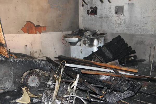 Interior of a garage following a fire, explosion or vandalism