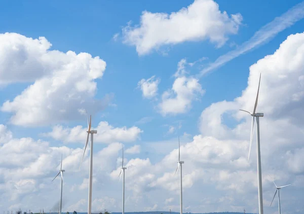 Wind turbines of global ecology with cloud background on the sky. alternative electricity source to be sustainable resources in the future. Clean energy concept saves the world.
