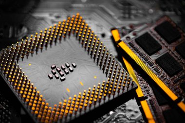 Macro Close up of RAM Memory and pins on Main CPU PC processor circuit board.	