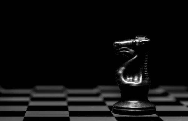 Close Chess Pieces Reflective Mirror Board Surface Plain Black Background — Stock Photo, Image