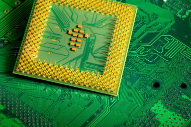 Macro Close up of microchips and pins on Main CPU PC processor circuit board.	