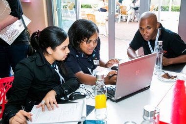 Johannesburg, South Africa - February 24, 2014: Diverse College students attending a business leadership workshop