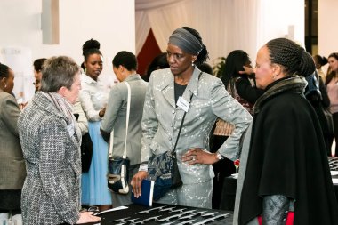 Johannesburg, South Africa - July 14, 2014: Diverse woman networking at corporate convention event