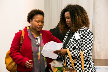 Johannesburg, South Africa - July 14, 2014: Diverse woman networking at corporate convention event