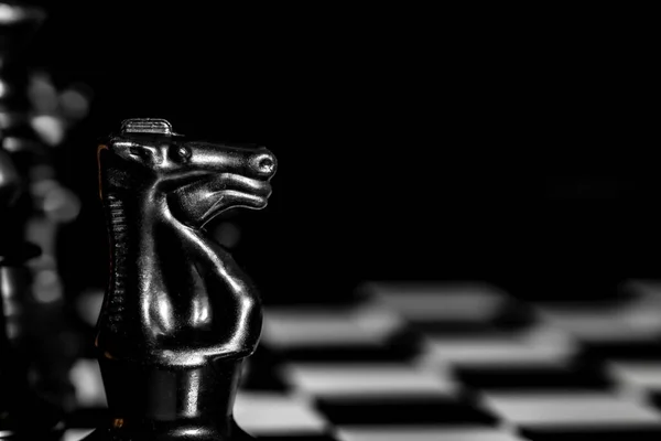 Close Chess Pieces Reflective Mirror Board Surface Plain Black Background — Stock Photo, Image