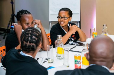 Johannesburg, South Africa - February 24, 2014: Diverse College students attending a business leadership workshop