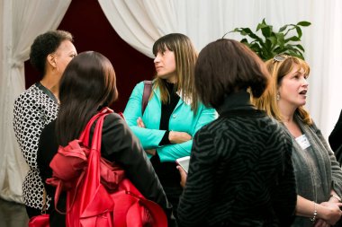 Johannesburg, South Africa - July 14, 2014: Diverse woman networking at corporate convention event
