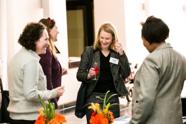 Johannesburg, South Africa - July 14, 2014: Diverse woman networking at corporate convention event