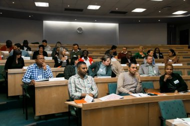 Johannesburg, south Africa - August 31, 2014: Diverse students attending a lecture in College Auditorium