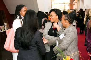 Johannesburg, South Africa - July 14, 2014: Diverse woman networking at corporate convention event