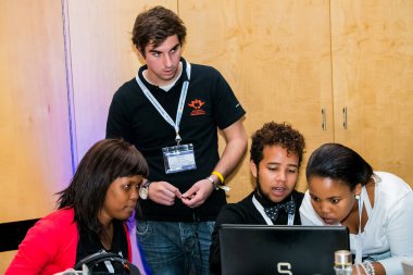 Johannesburg, South Africa - February 24, 2014: Diverse College students attending a business leadership workshop