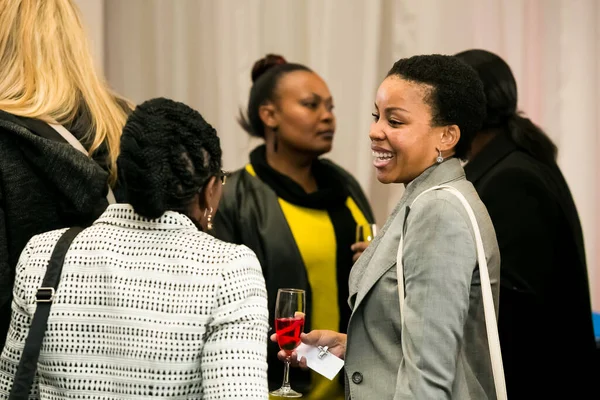 Johannesburg, South Africa - July 14, 2014: Diverse woman networking at corporate convention event