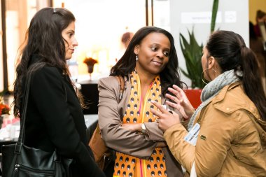 Johannesburg, South Africa - July 14, 2014: Diverse woman networking at corporate convention event