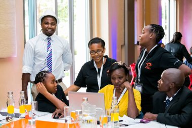 Johannesburg, South Africa - February 24, 2014: Diverse College students attending a business leadership workshop
