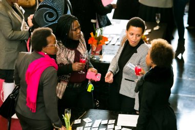 Johannesburg, South Africa - July 14, 2014: Diverse woman networking at corporate convention event