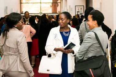 Johannesburg, South Africa - July 14, 2014: Diverse woman networking at corporate convention event