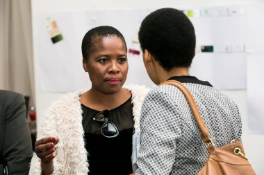 Johannesburg, South Africa - July 14, 2014: Diverse woman networking at corporate convention event