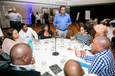 Johannesburg, South Africa - November 28, 2013: Diverse delegates attending a networking and leadership workshop