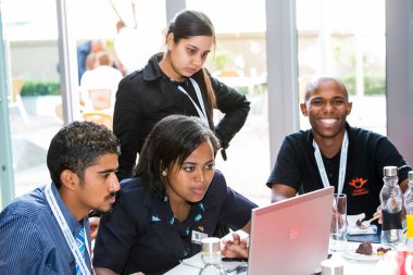 Johannesburg, South Africa - February 24, 2014: Diverse College students attending a business leadership workshop