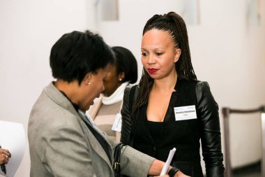 Johannesburg, South Africa - July 14, 2014: Diverse woman networking at corporate convention event