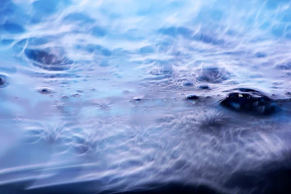 abstract macro shot of blue liquid soap