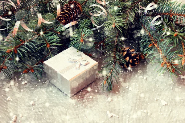 Silver gift box on a sparkling christmas background — Stock Photo, Image