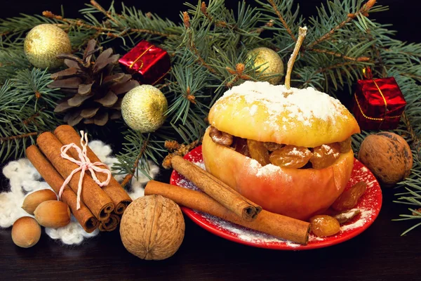 Yummy baked apple, cinnamon sticks, nuts. christmas snack — Stock Photo, Image