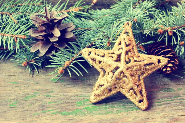 Golden star on a wooden background — Stock Photo, Image