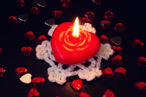 Beautiful red candle in the shape of heart — Stock Photo, Image