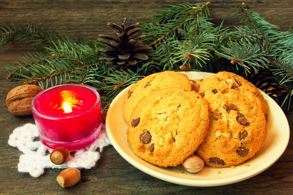 Christmas cookies and red candle — Stock Photo, Image